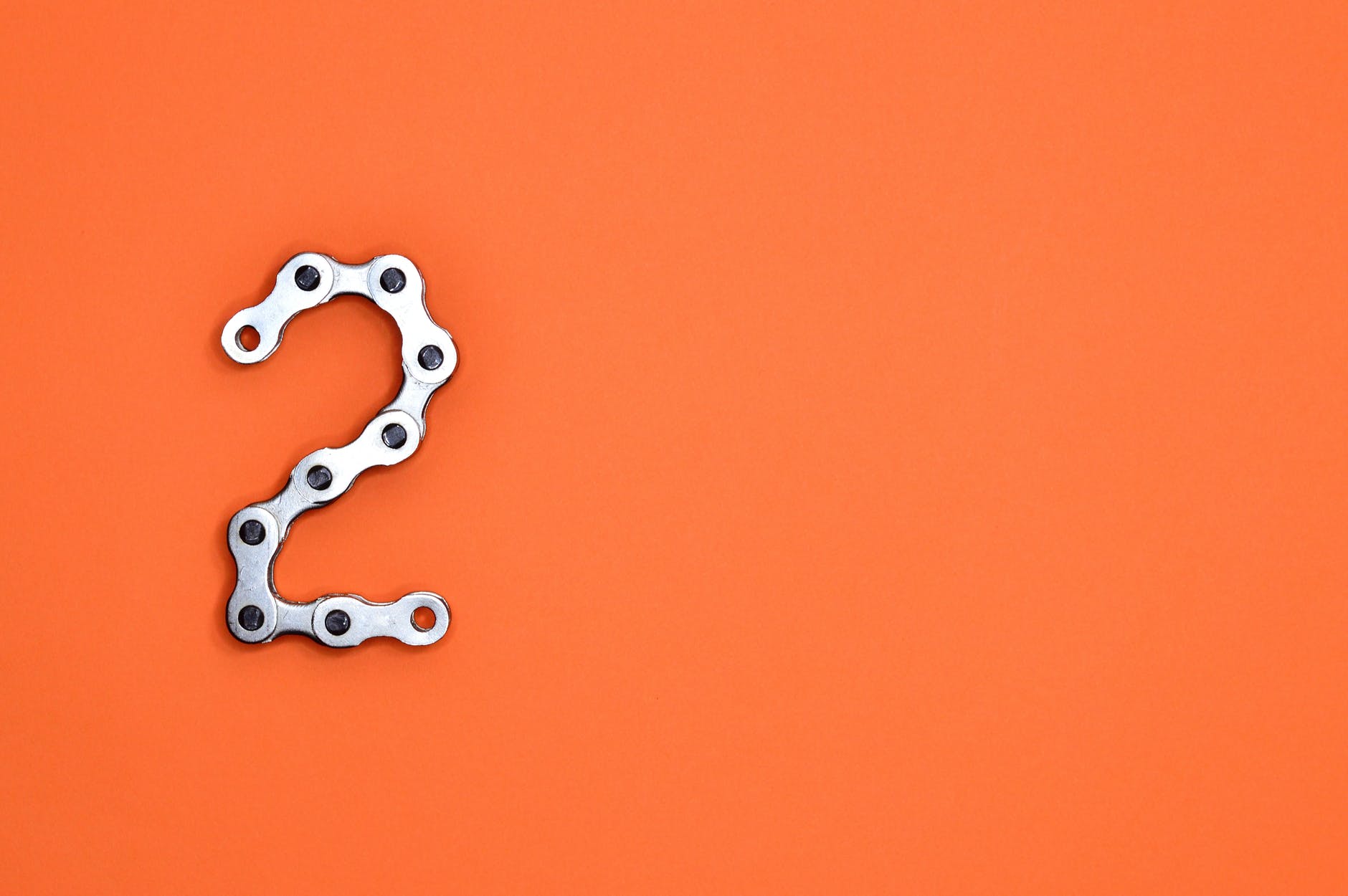 gray steel chain on orange surface